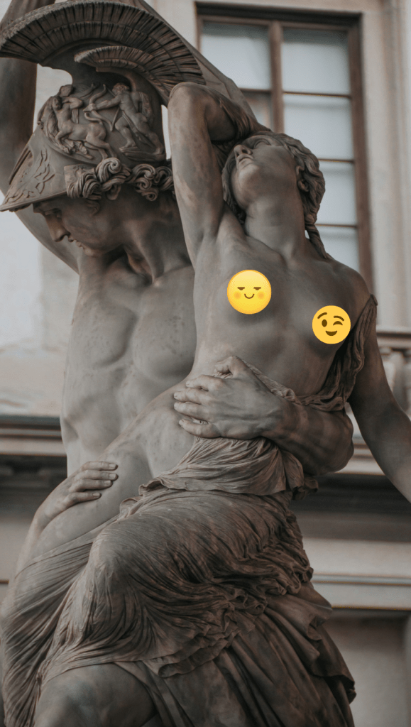 Classical sculpture with a topless woman's breasts hidden by emojis.
